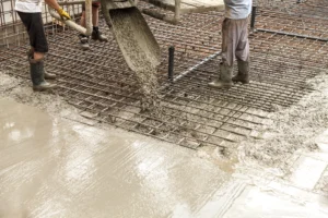 Construction crew pouring concrete for a new foundation project in New Haven, IN.
