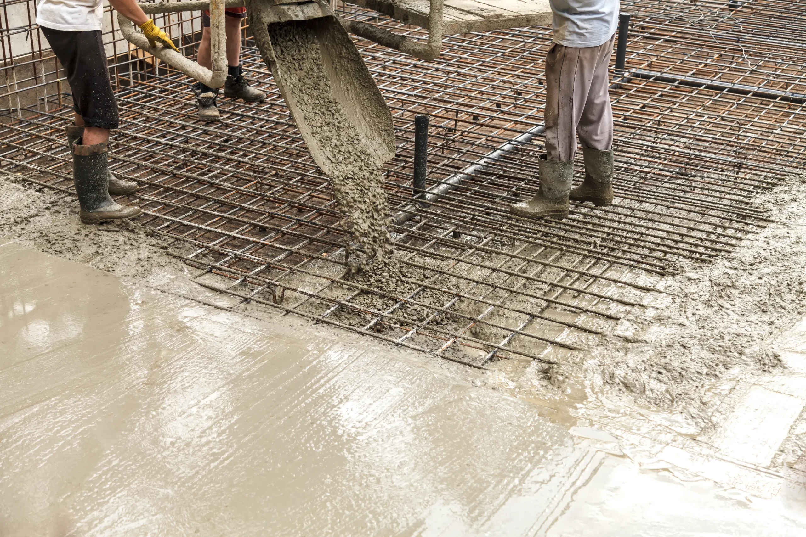 Construction crew pouring concrete for a new foundation project in New Haven, IN.